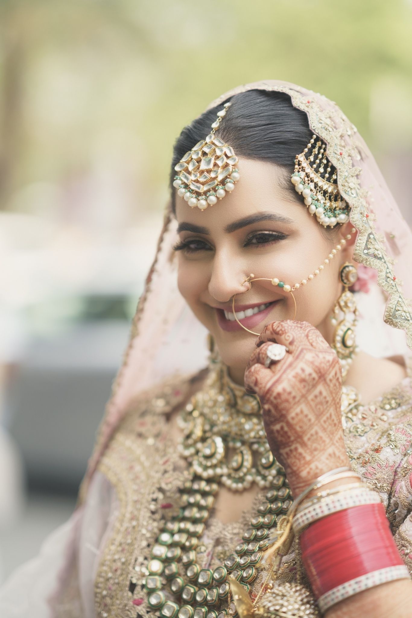 Bride close-up portrait with traditional jewelry Punjabi wedding Chandigarh photographer