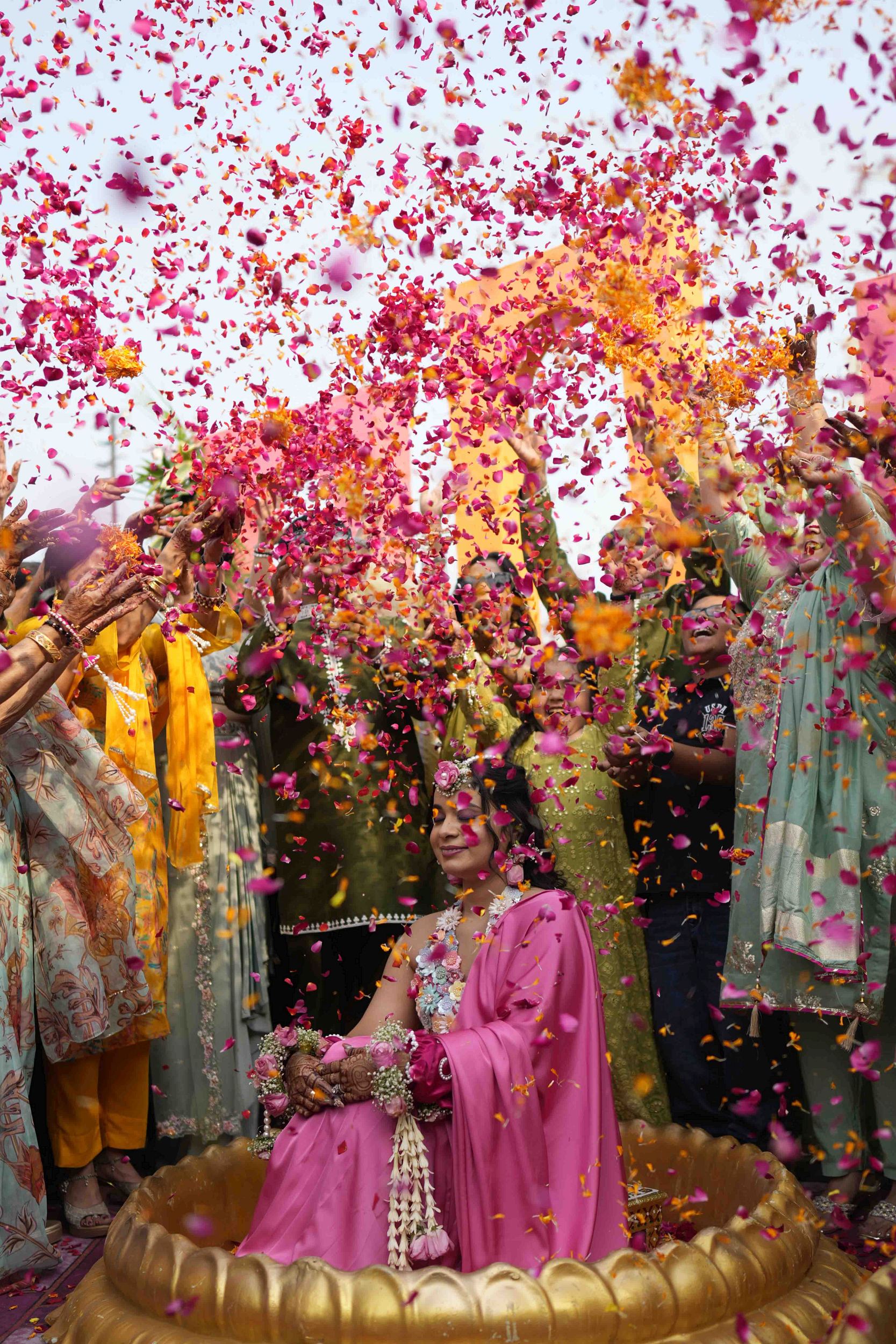 Joyful candid moment of bride during vibrant Haldi ceremony celebration