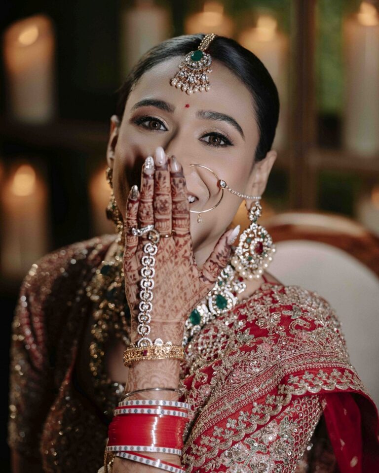 bride-candid-smile-mehandi-hands-01 Joyful candid bridal portrait with beautiful smile and mehandi adorned hands