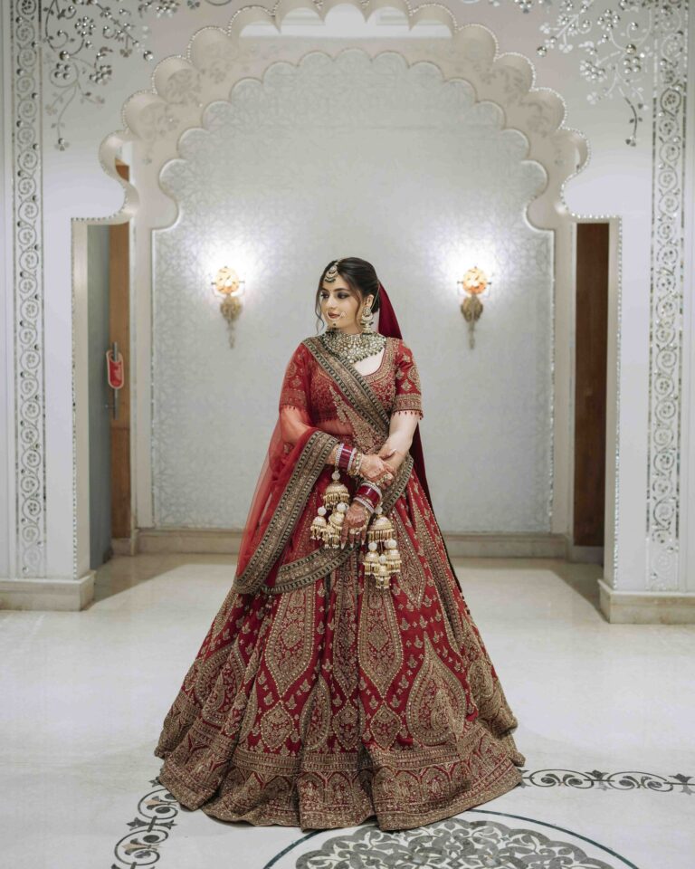 bride-full-outfit-red-lehenga-portrait-03 Stunning full-length bridal portrait in red lehenga with traditional North Indian jewelry