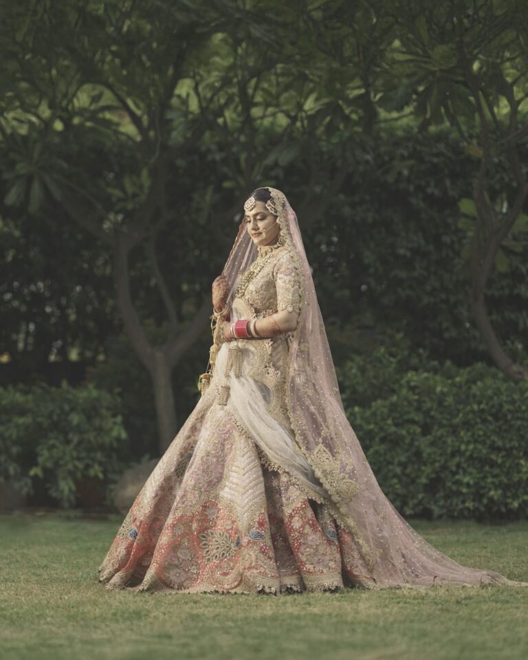 bride-outdoor-shoot-with-pink-lehenga-02 Elegant bride in pink lehenga outdoor shoot with traditional jewelry and makeup