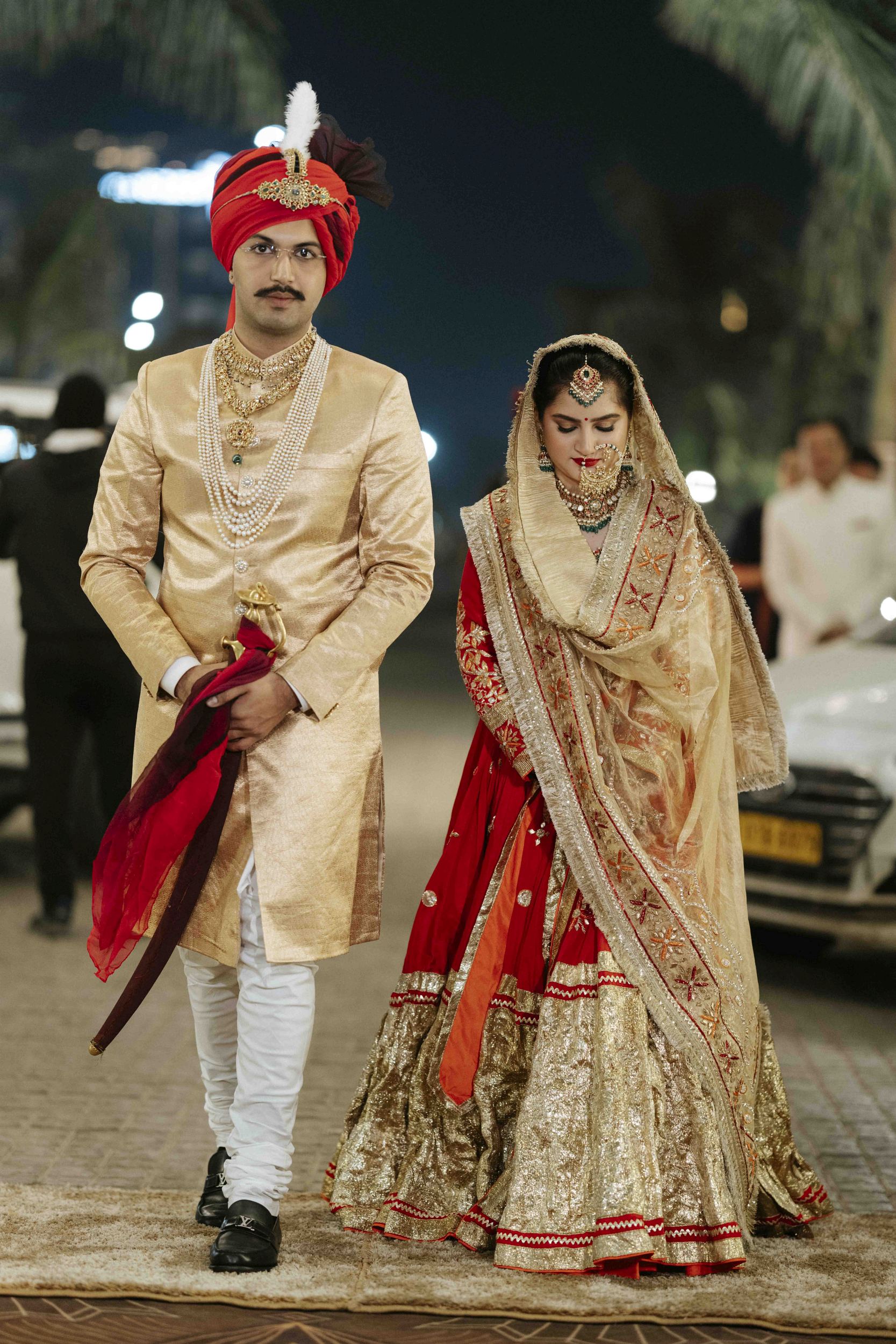 Candid shot of bride and groom entering wedding venue together