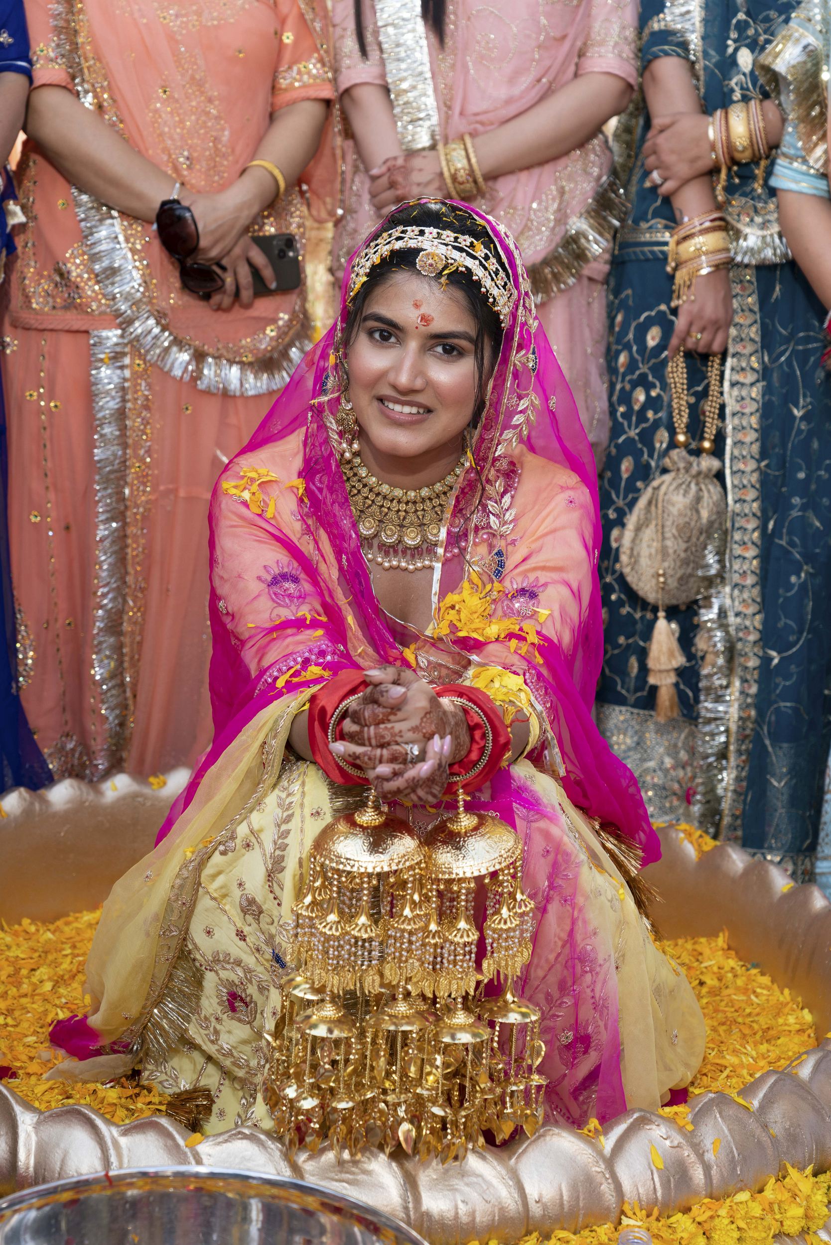 Bride showcasing beautiful Kalichdi ceremony at riya ruchier wedding